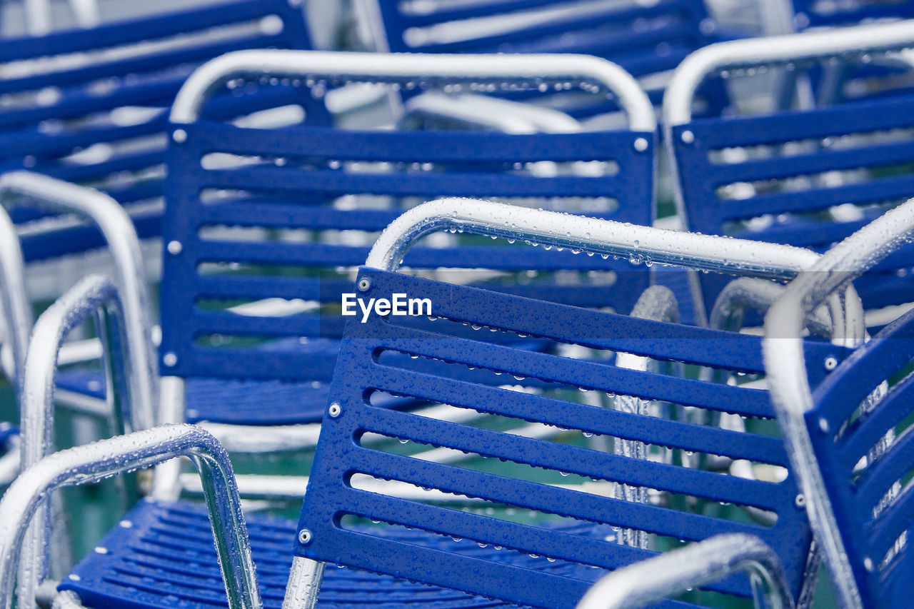 Full frame shot of wet empty chairs during rainy season