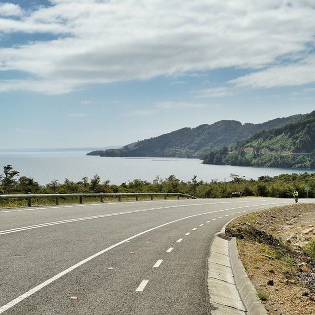 VIEW OF ROAD AGAINST CLOUDY SKY