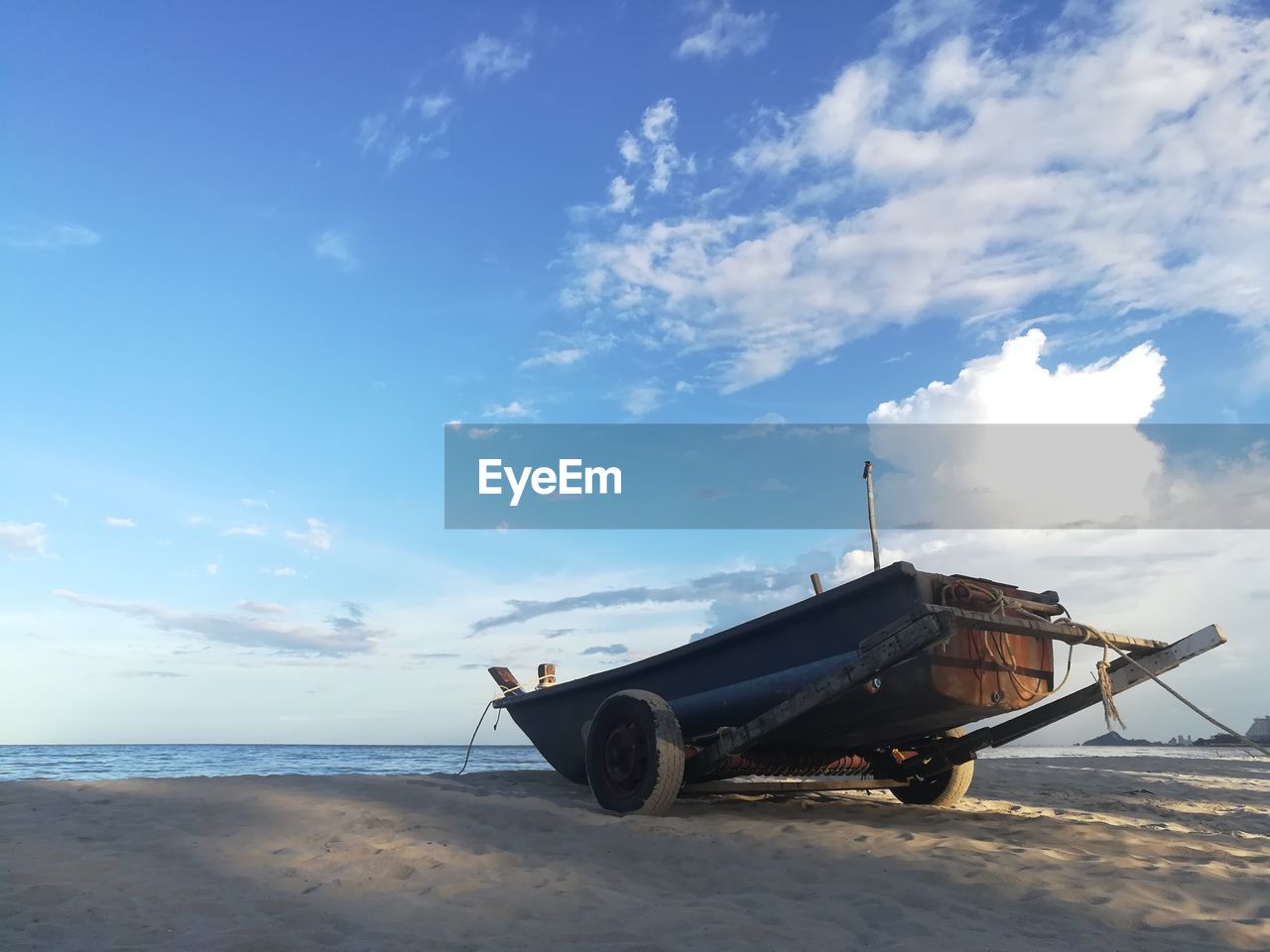 ABANDONED BOAT ON BEACH