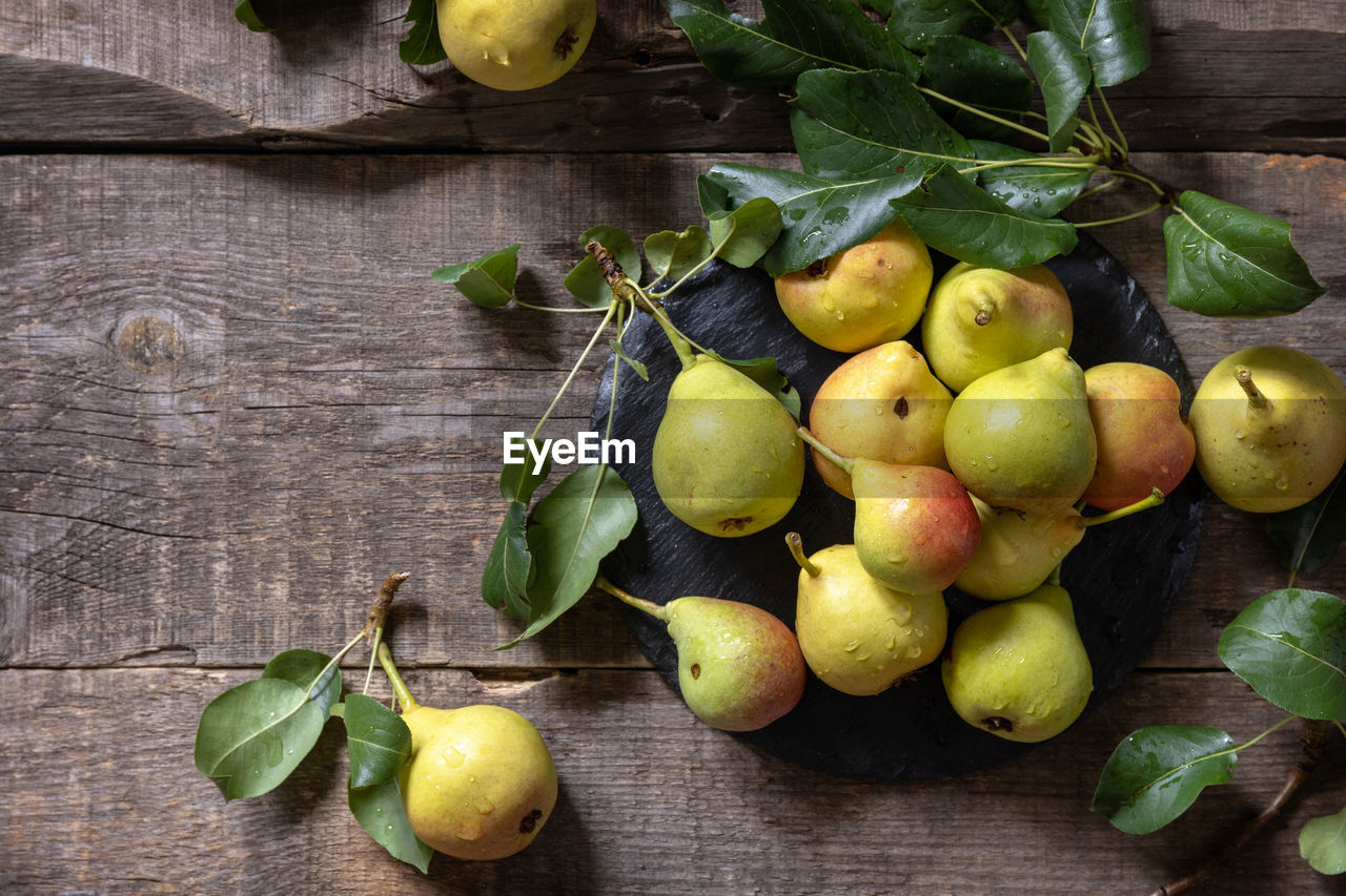 Organic healthy juicy ripe pear on a wooden kitchen table. the concept of diet menu. 