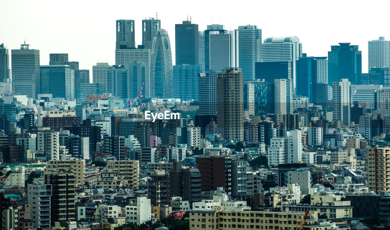 Modern buildings in city against sky