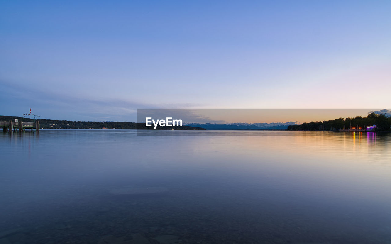 VIEW OF LAKE AGAINST SKY DURING SUNSET