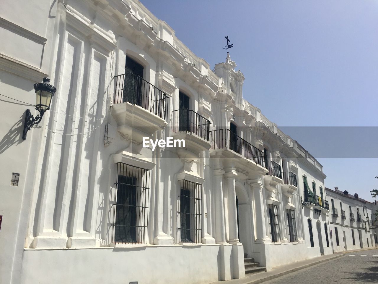 Low angle view of building against clear blue sky