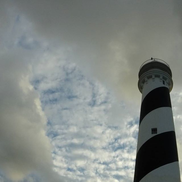 LOW ANGLE VIEW OF TOWER AGAINST CLOUDY SKY
