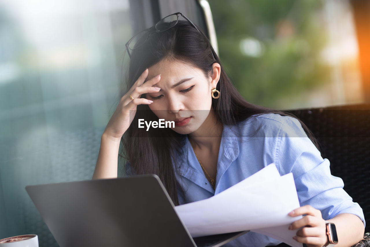 Young woman using laptop