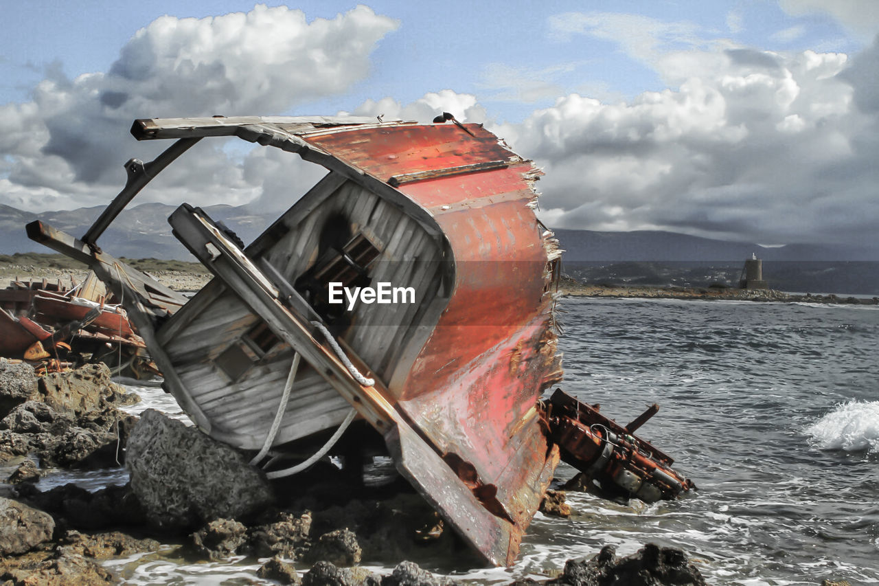 ABANDONED BOAT ON BEACH