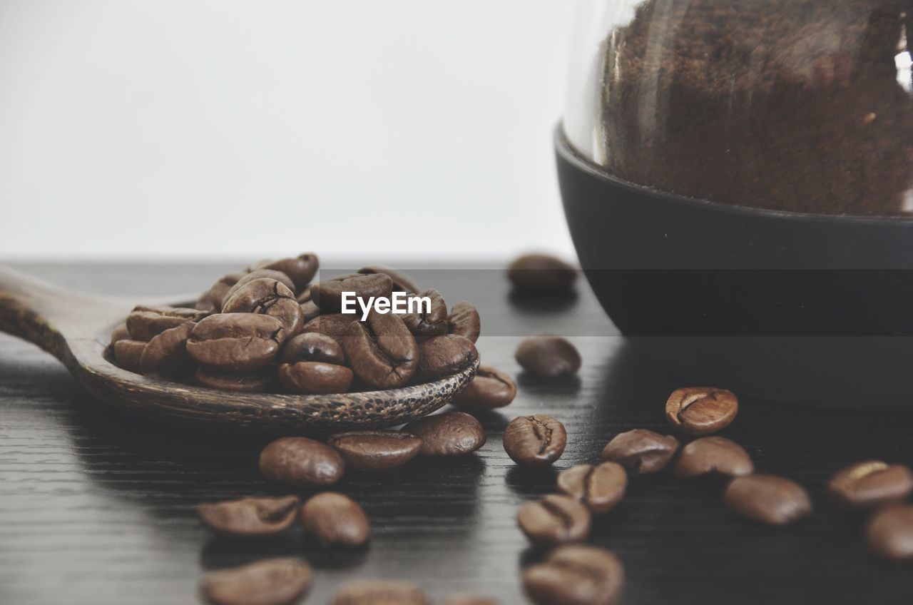 CLOSE-UP OF COFFEE BEANS IN GLASS