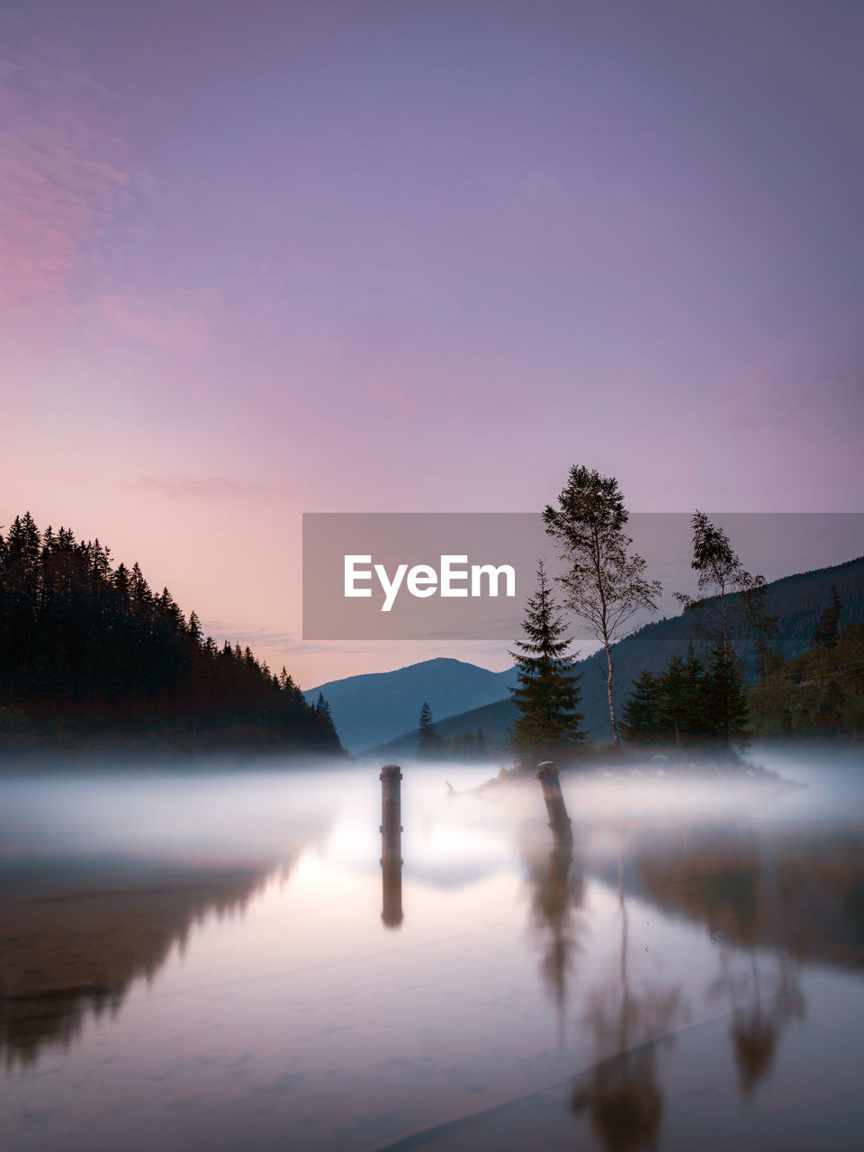 Scenic view of lake against sky during sunset