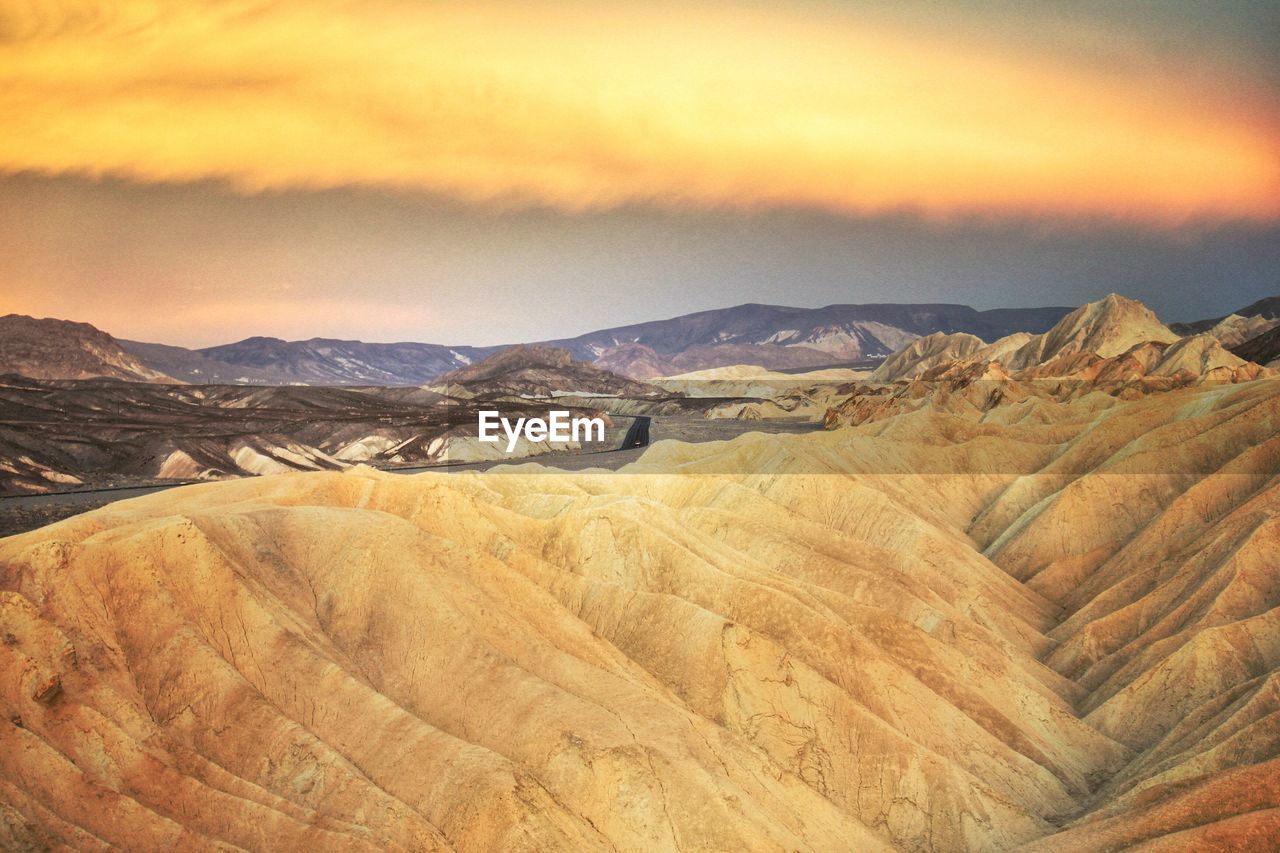 Idyllic shot of rock formation at death valley national park against sunset sky