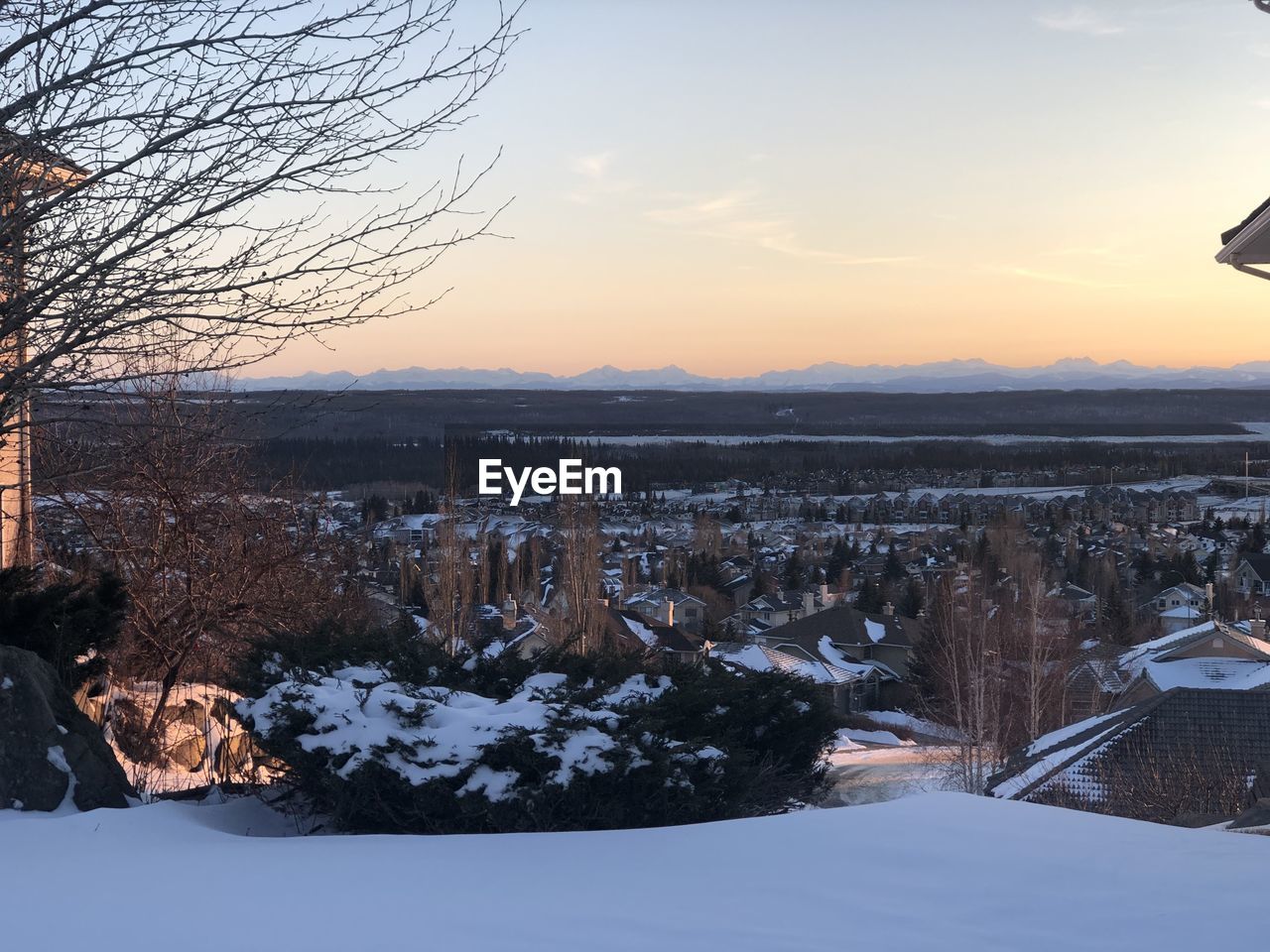 SNOW COVERED LANDSCAPE DURING SUNSET