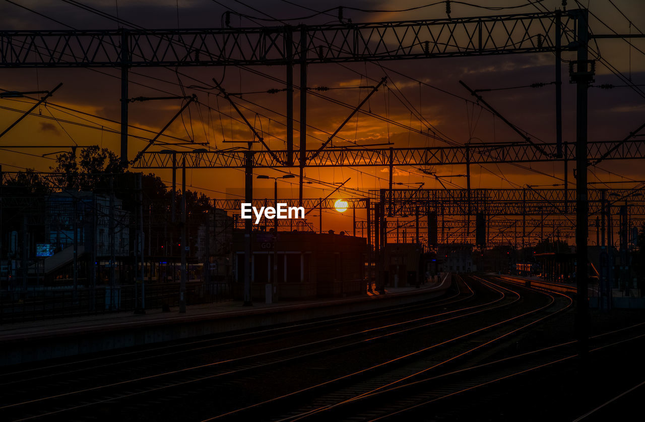 high angle view of railroad tracks against sky at sunset