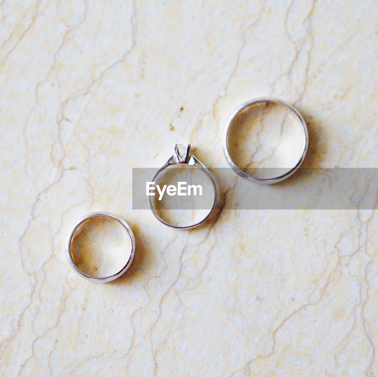 Directly above shot of rings arranged on table