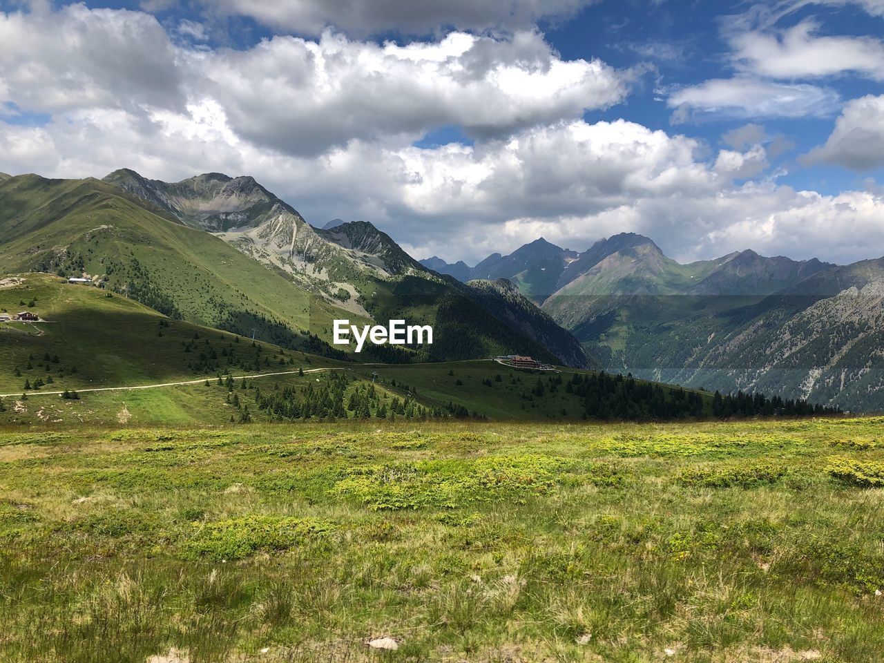 Scenic view of landscape and mountains against sky