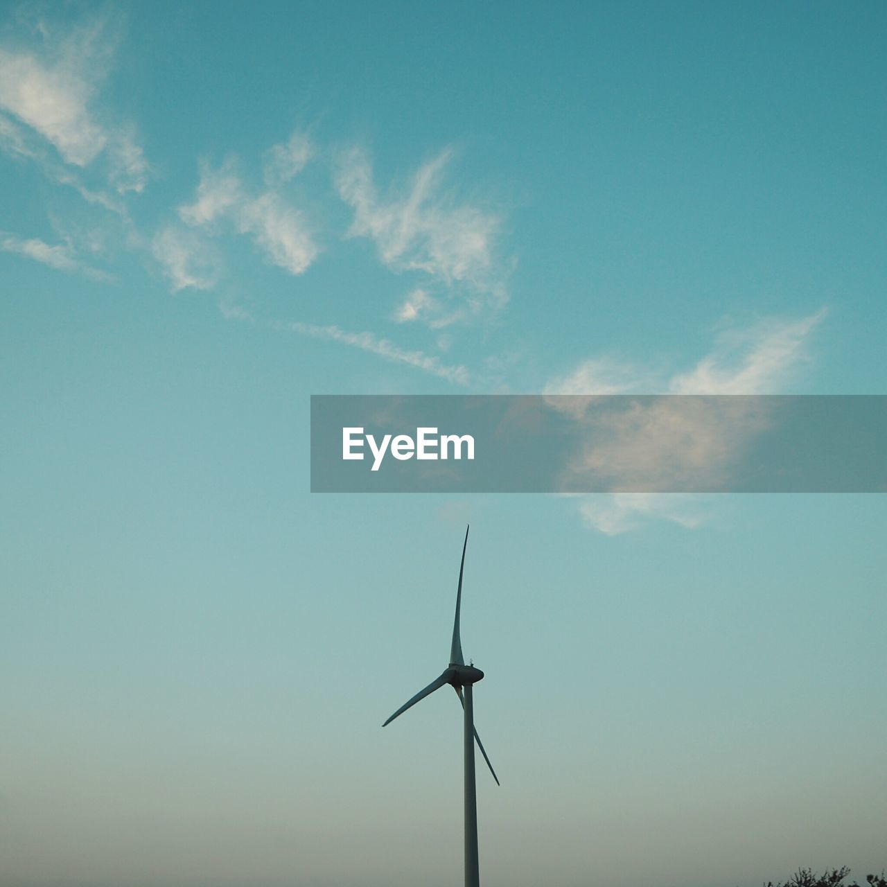 Low angle view of windmill against sky