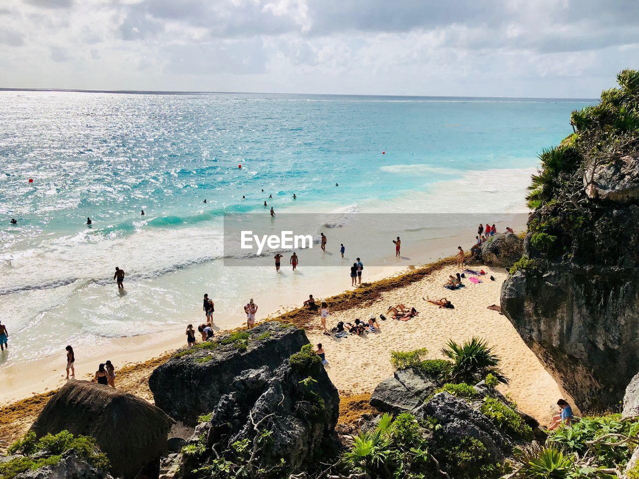 High angle view of people at beach during sunny day