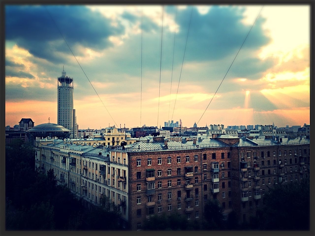 VIEW OF CITYSCAPE AT SUNSET