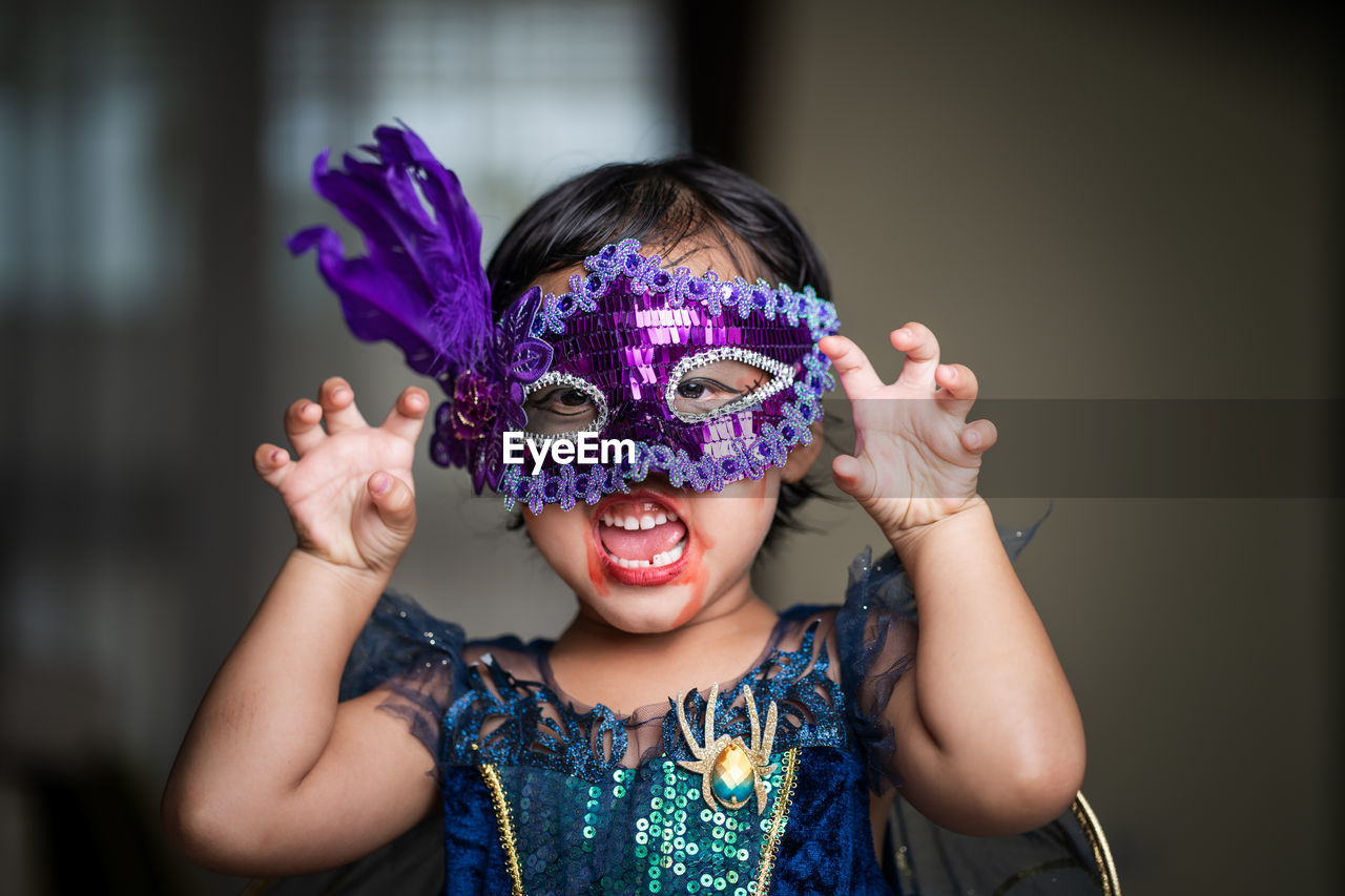 Portrait of cute girl in halloween costume.