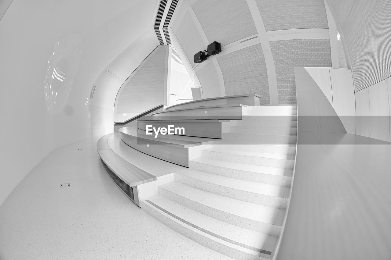 staircase, steps and staircases, stairs, architecture, indoors, white, railing, spiral, spiral staircase, built structure, black and white, ceiling, curve, monochrome, monochrome photography, high angle view, daylighting, futuristic
