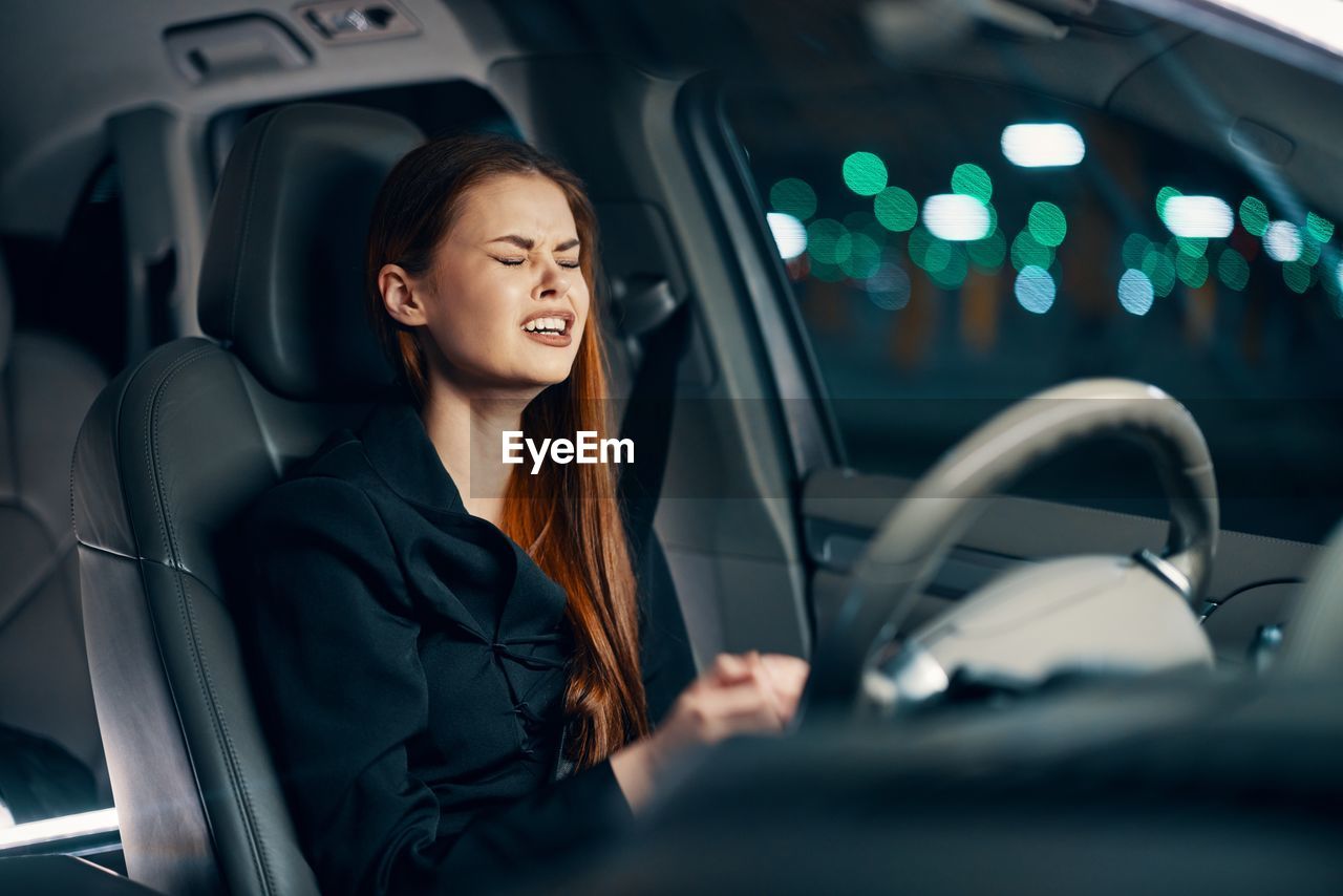 Woman crying sitting in car