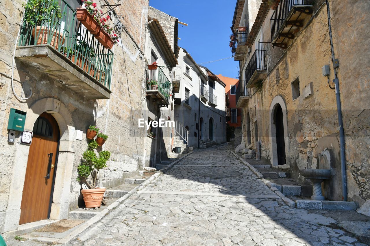 A narrow street of guardia sanframondi, a village in the province of benevento, italy.