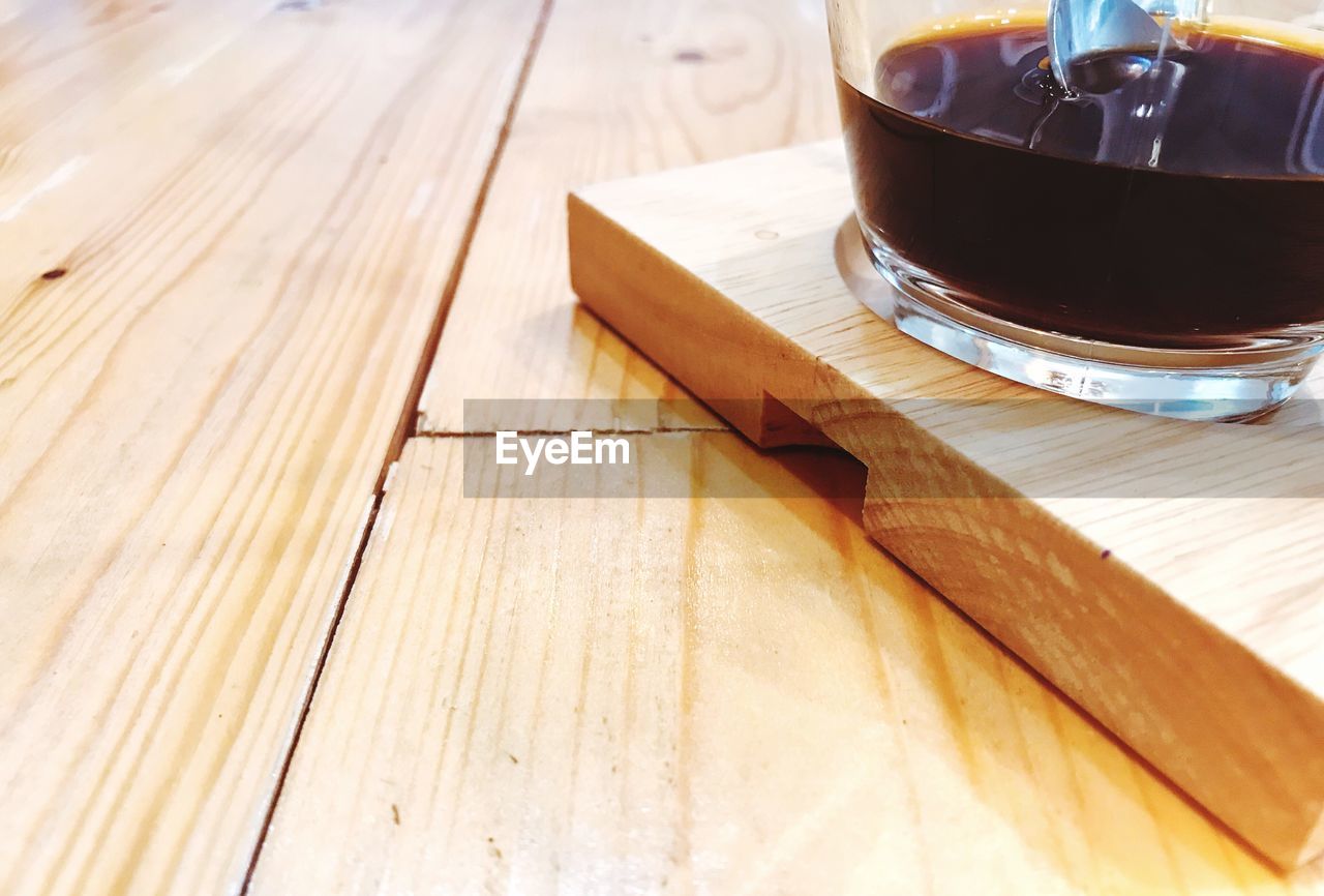 CLOSE-UP OF COFFEE CUP ON TABLE