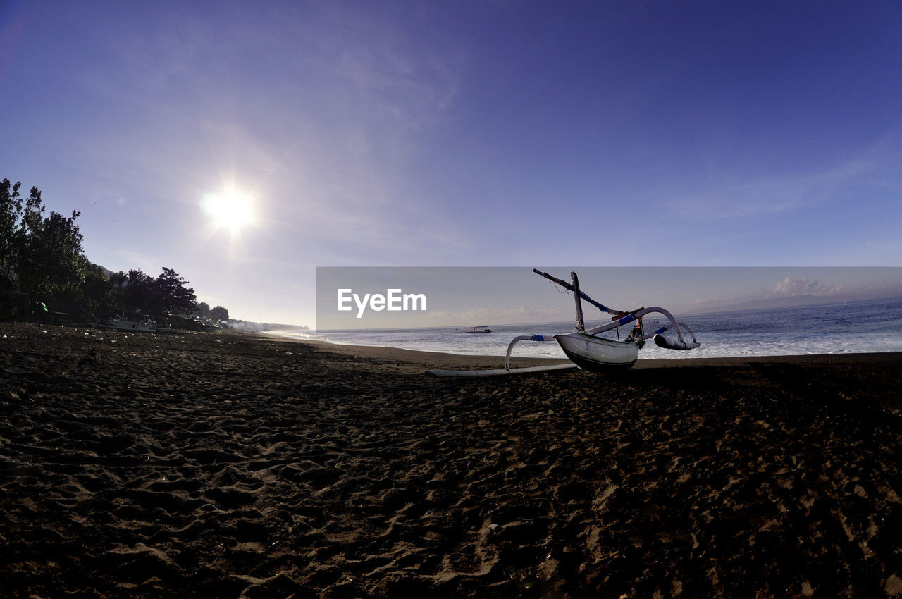 PERSON ON BEACH AGAINST SKY