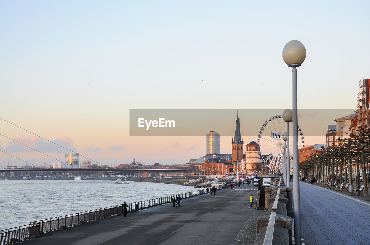 Bridge over river with city in background