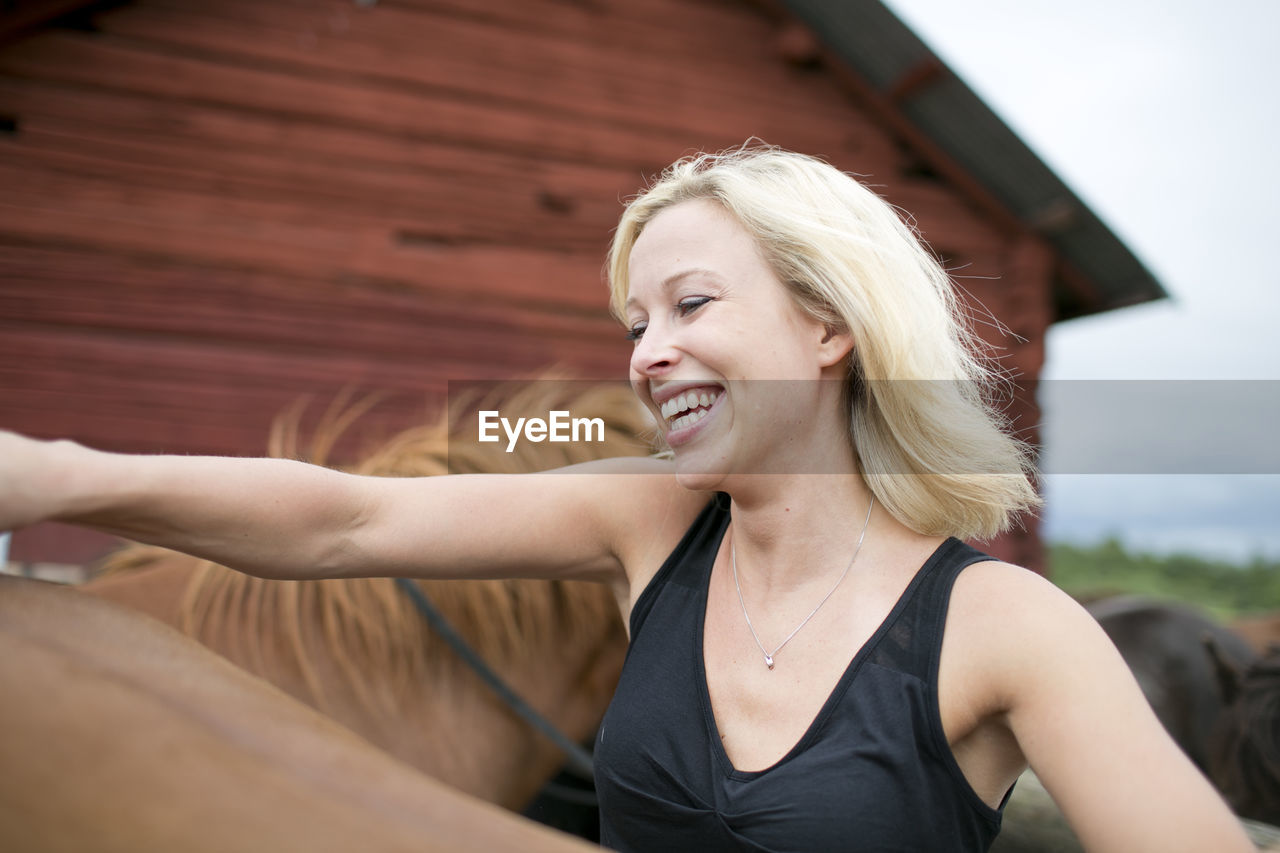 Young woman with horse