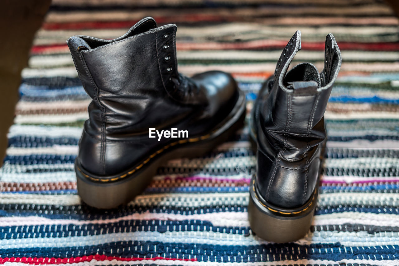 Close-up of shoes on carpet