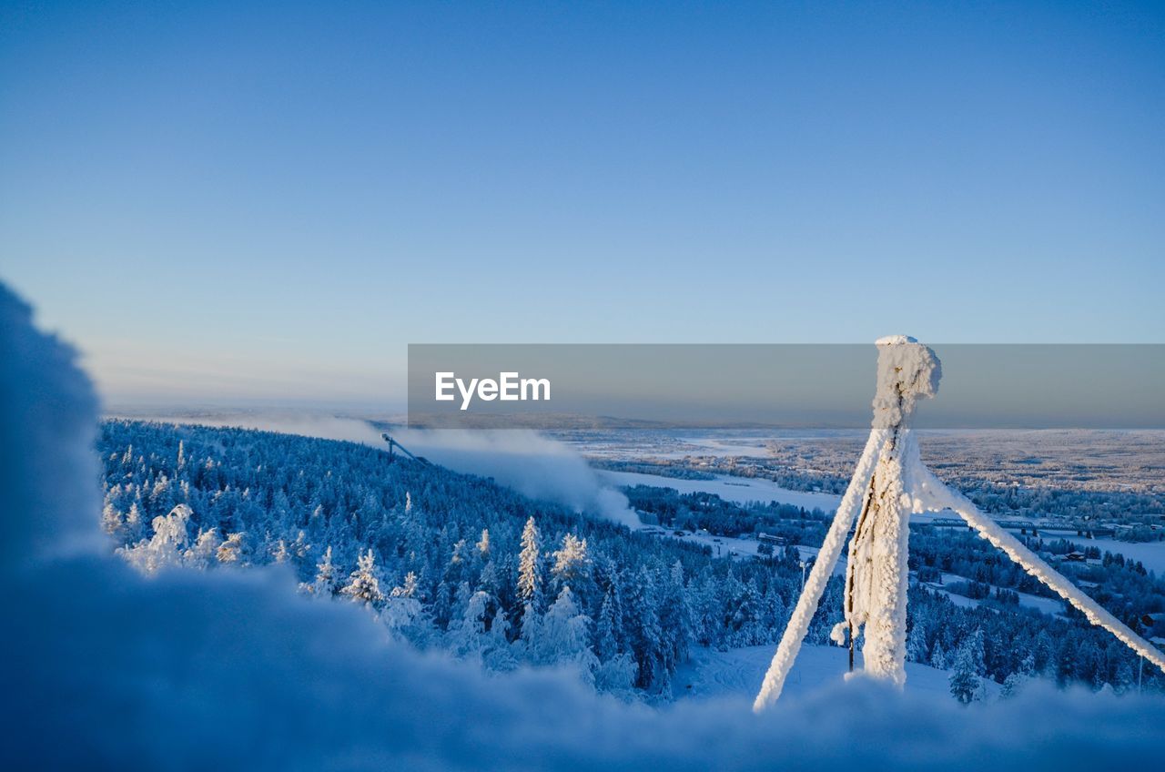 Scenic view of snow covered landscape against sky