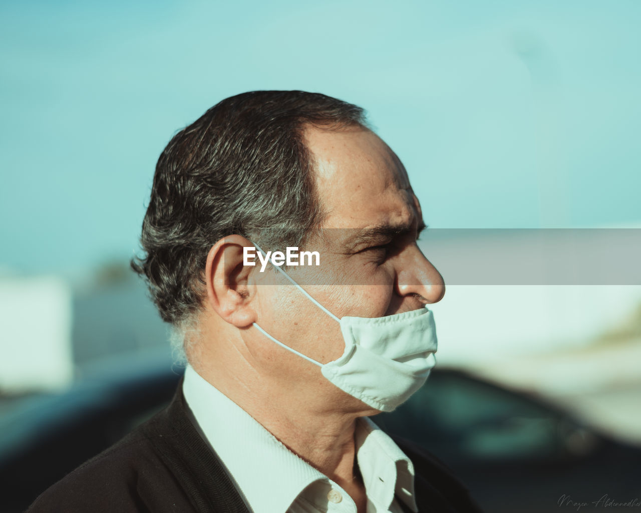 Close-up portrait of man wearing a mask