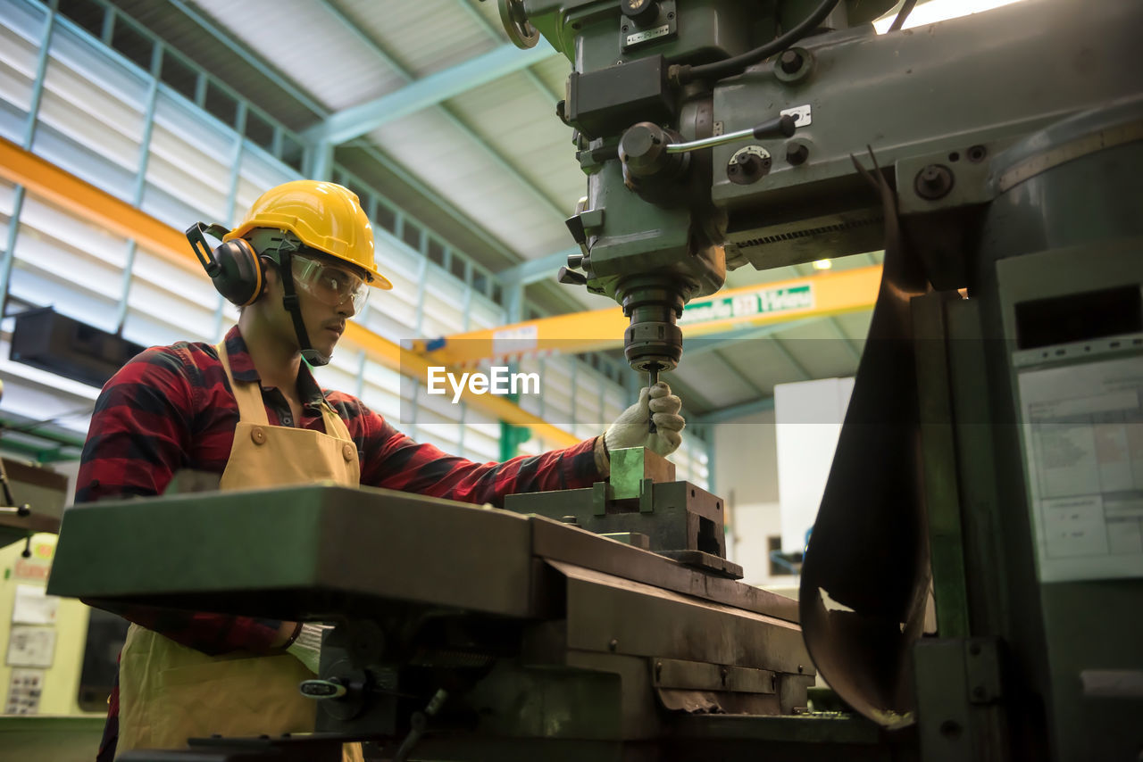 MAN WORKING ON FACTORY