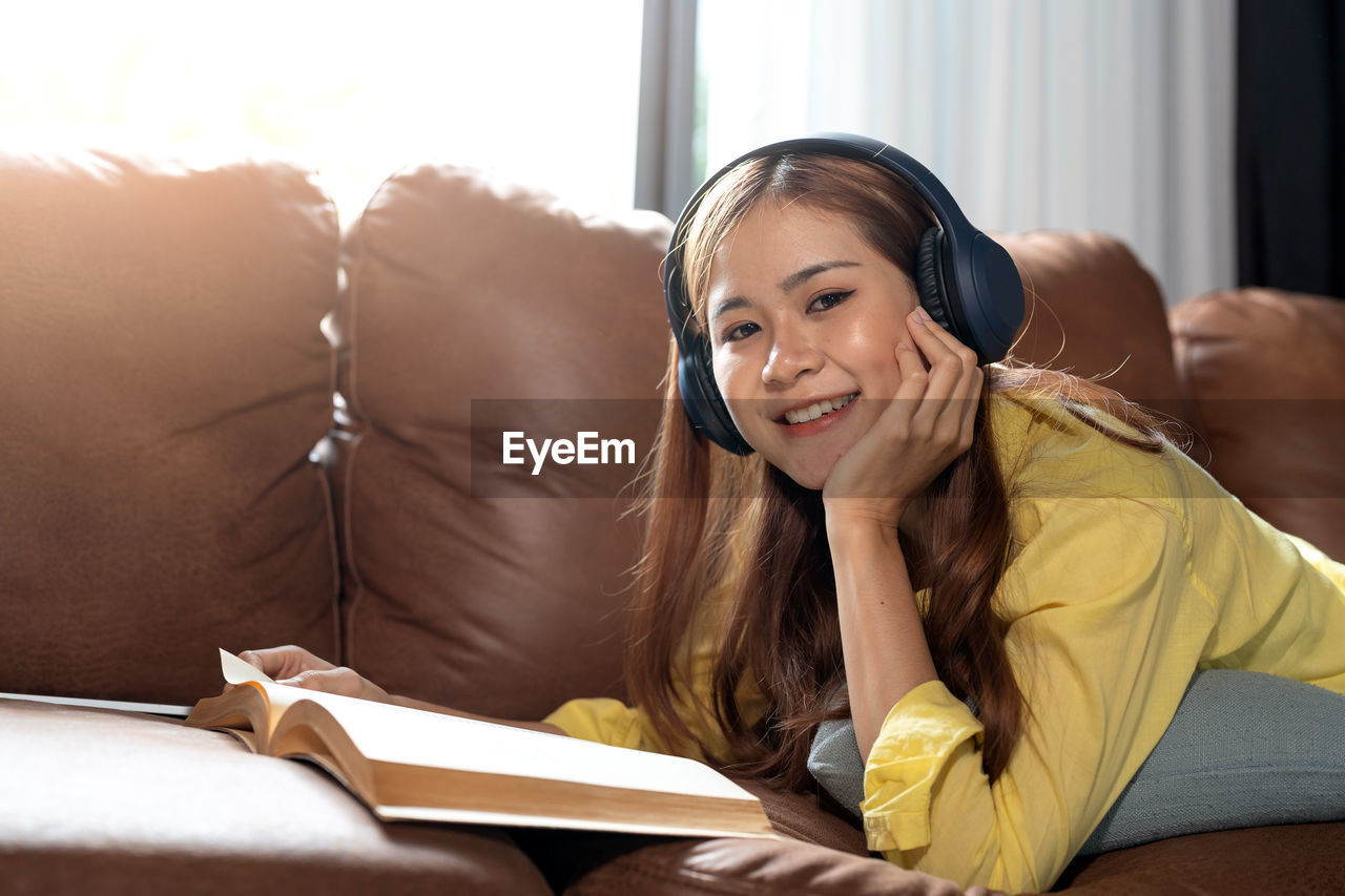 portrait of young woman reading book