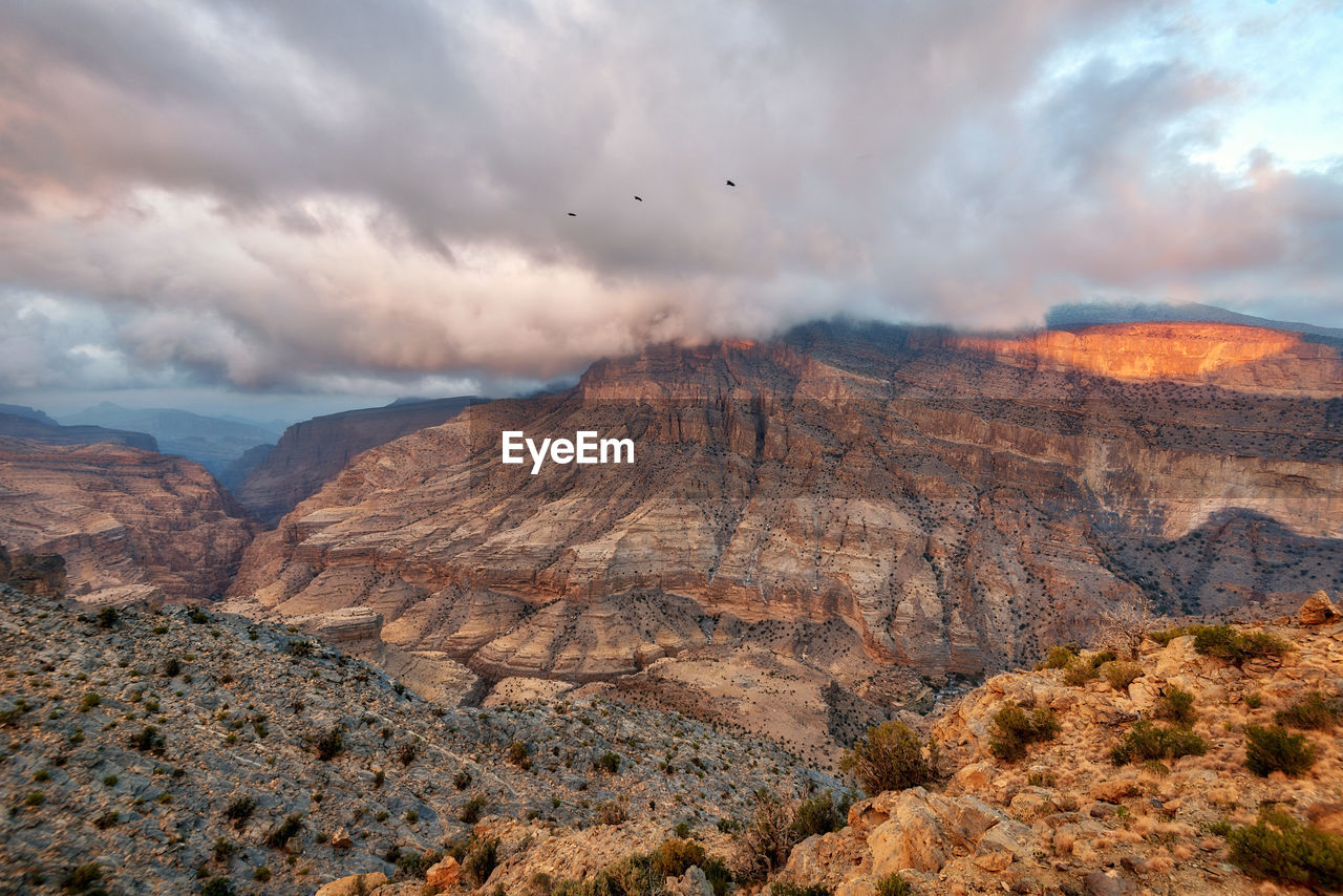 Scenic view of rocky mountains against sky