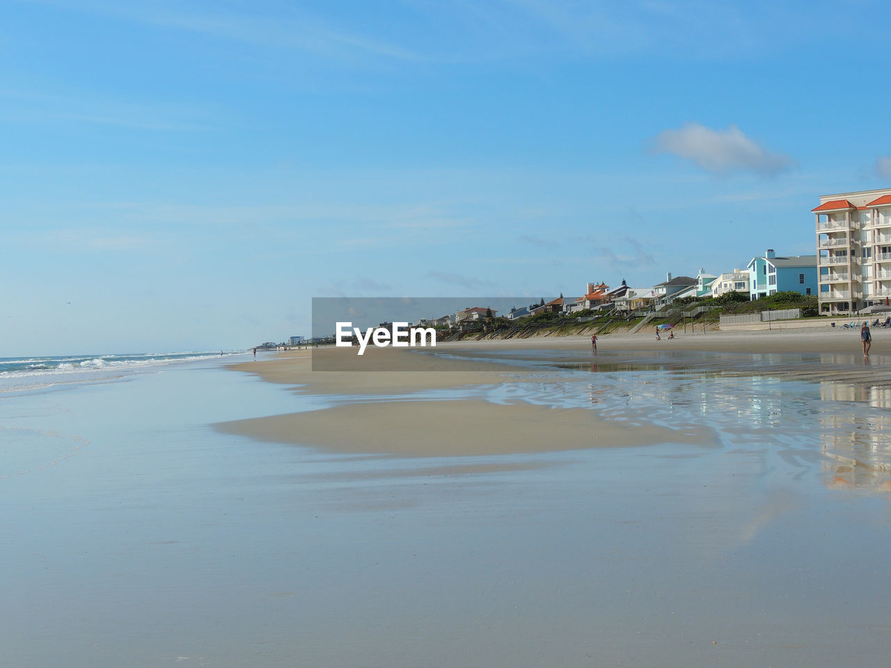 View of beach against blue sky