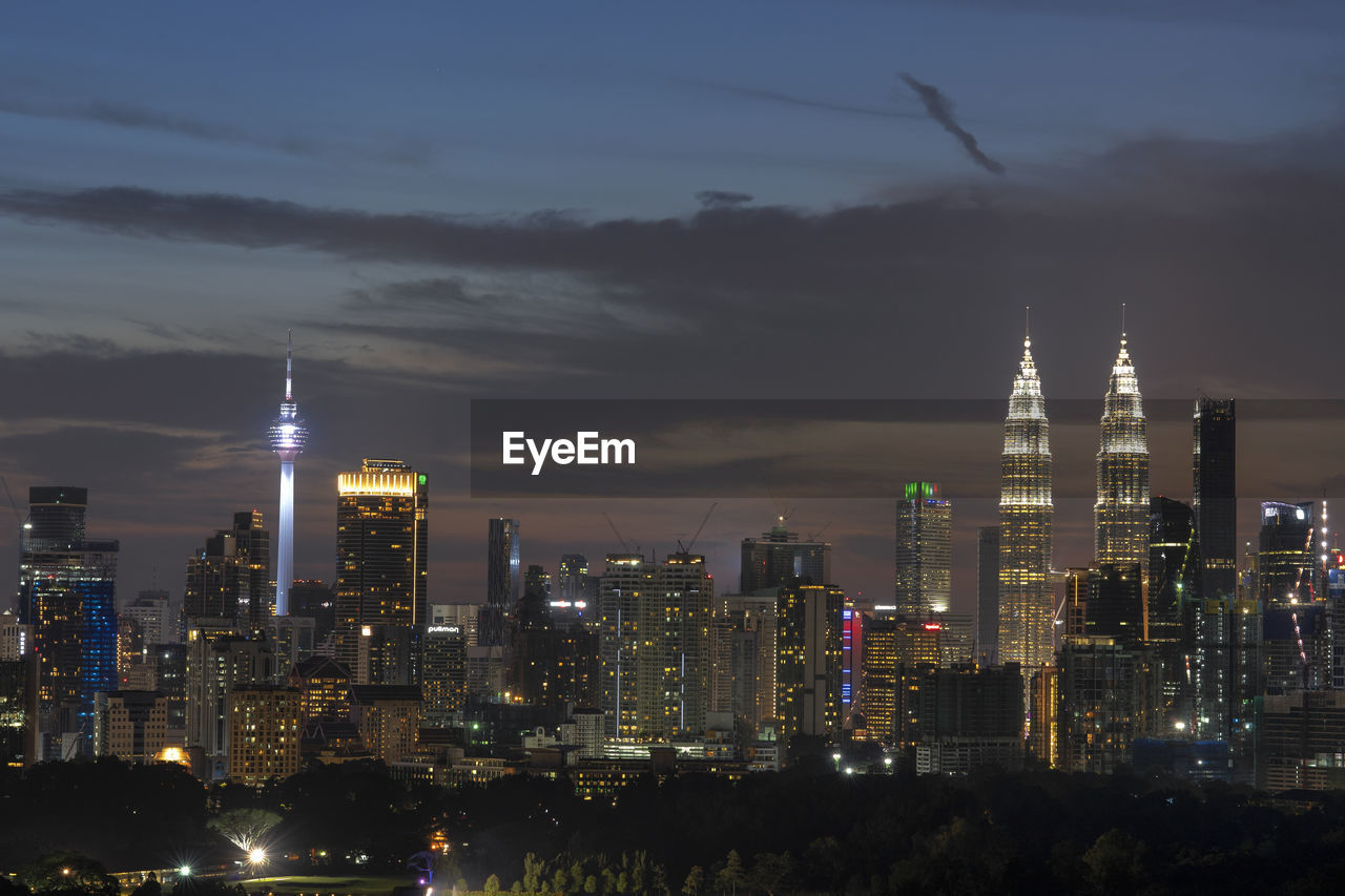 Illuminated buildings in city at night