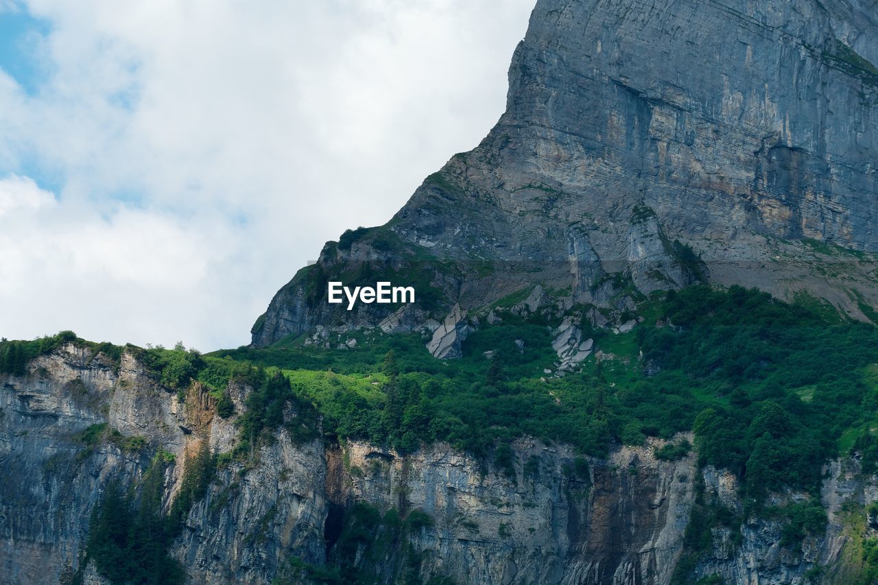 Low angle view of rock formations against sky