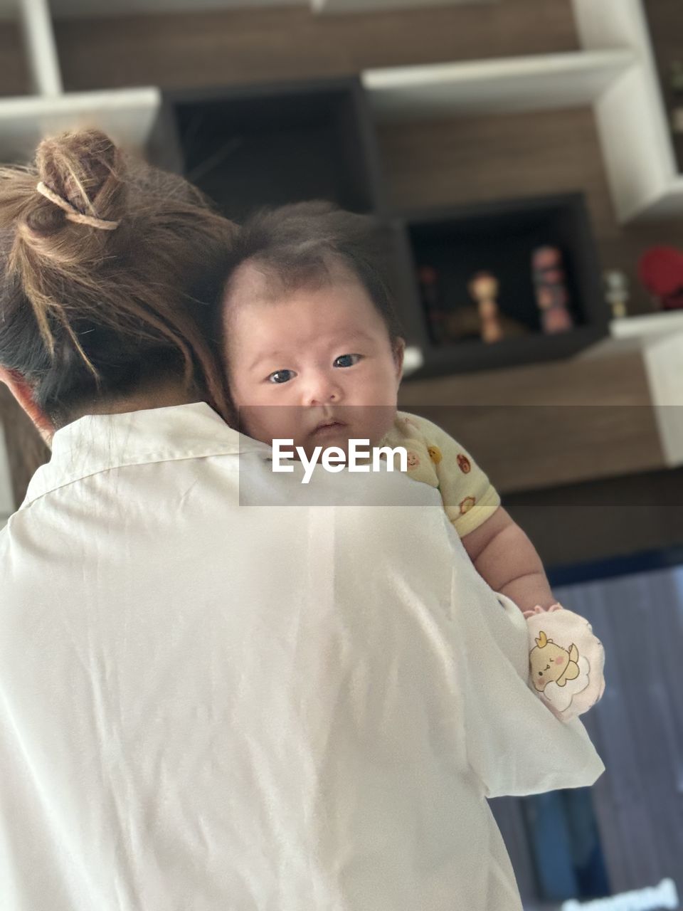 child, childhood, baby, women, two people, female, family, emotion, adult, person, indoors, parent, love, care, togetherness, positive emotion, innocence, one parent, cute, portrait, lifestyles, bonding, embracing, holding, clothing, waist up, toddler, looking at camera, looking, focus on foreground, happiness, standing, beginnings