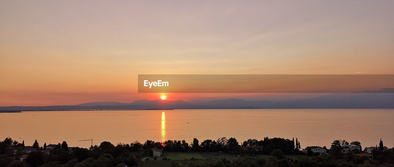 Panoramic view of lake during sunset