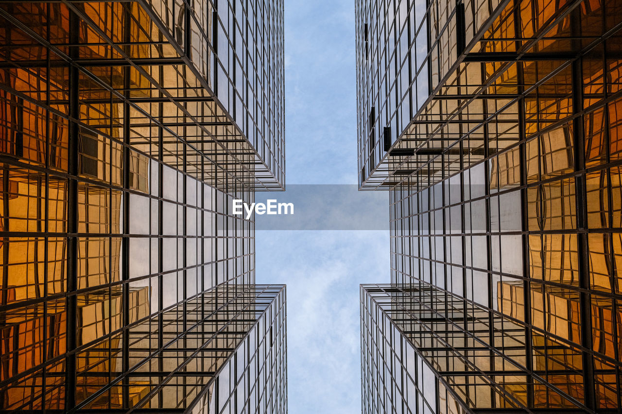 Low angle view of modern buildings against sky