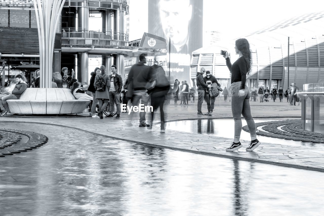 PEOPLE WALKING ON CITY STREET