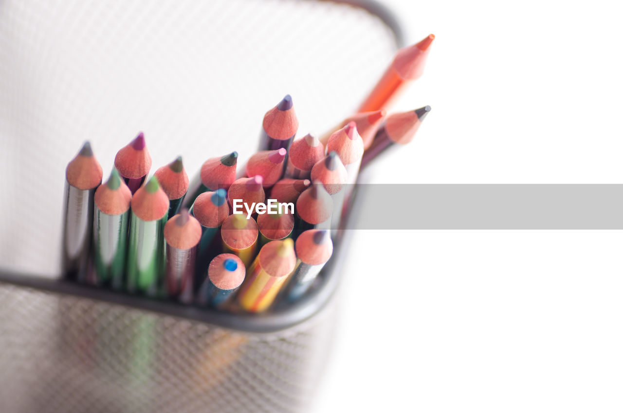 CLOSE-UP OF MULTI COLORED PENCILS IN CONTAINER