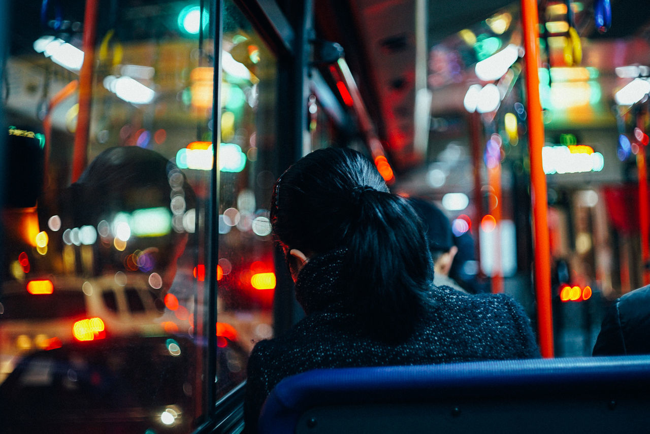 WOMAN LOOKING AT NIGHT