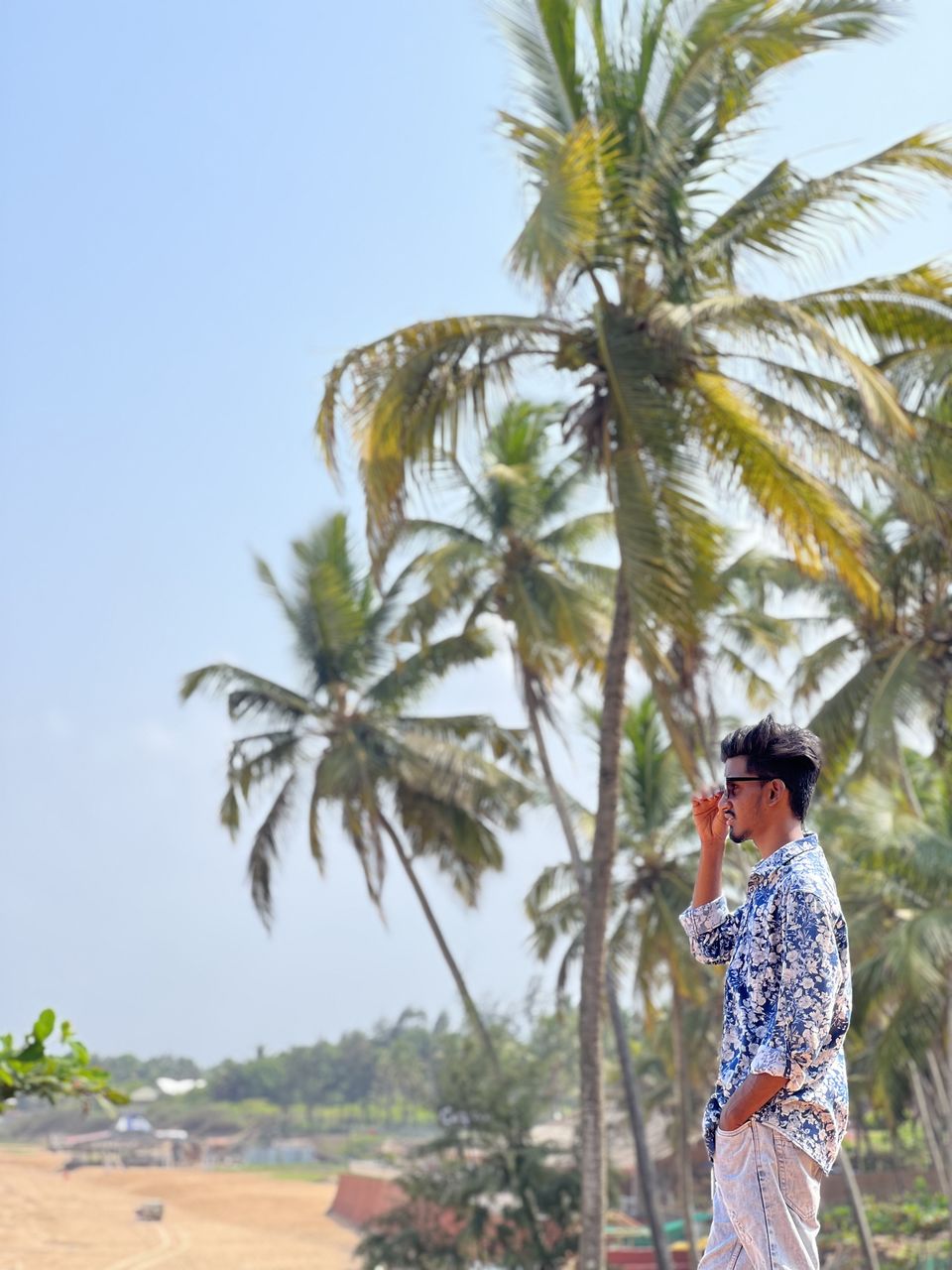 rear view of woman standing on beach