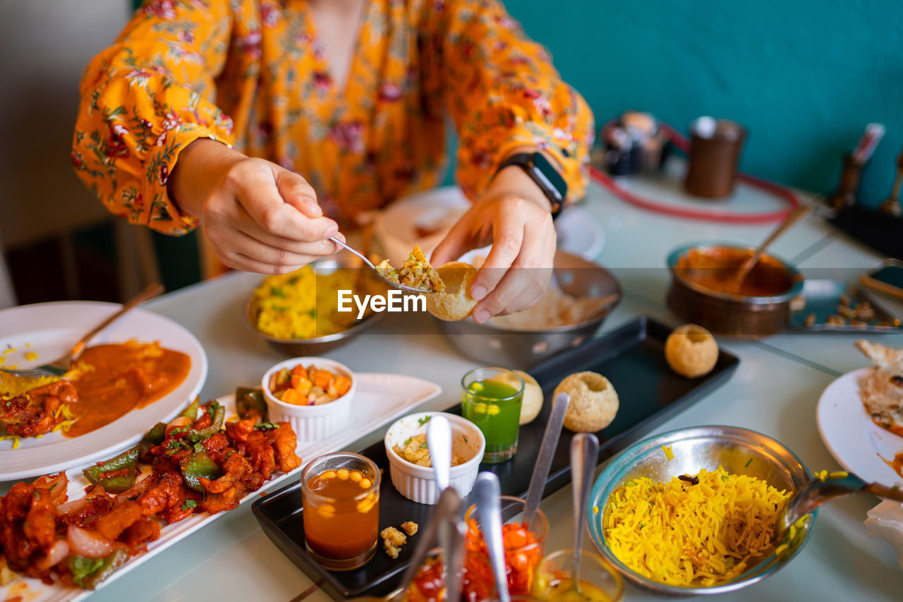 Indian food curry butter chicken, palak paneer, chiken tikka, biryani, vegetable curry.