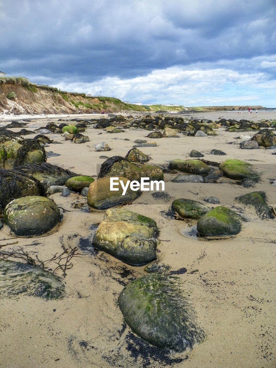 Stones on sandy beach