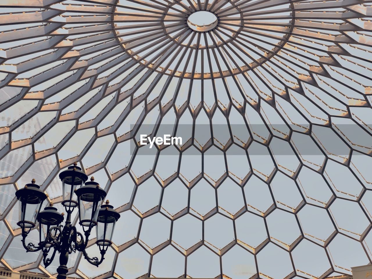 LOW ANGLE VIEW OF BICYCLE WHEEL WITH CEILING