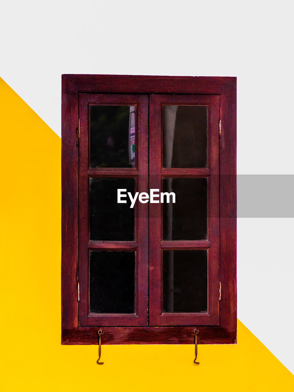 Close-up of yellow window on building