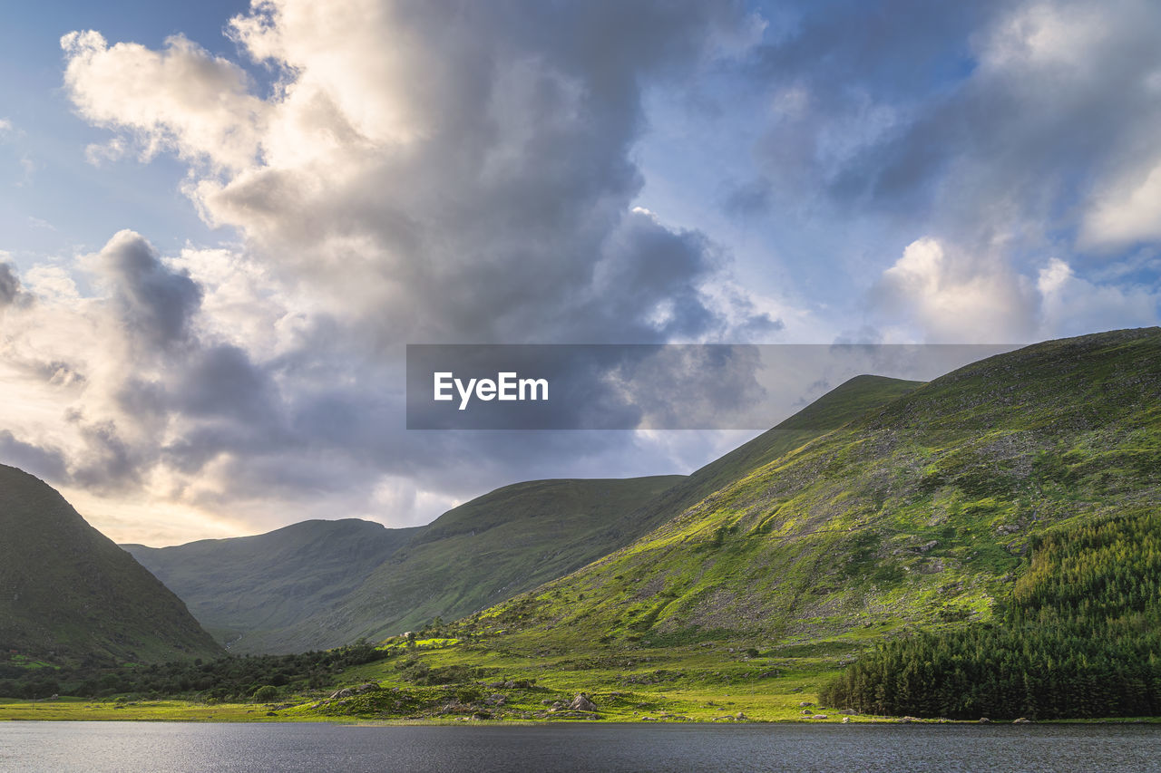 Gummeenduff lake and rocky hills of macgillycuddys reeks mountains in black valley, ireland