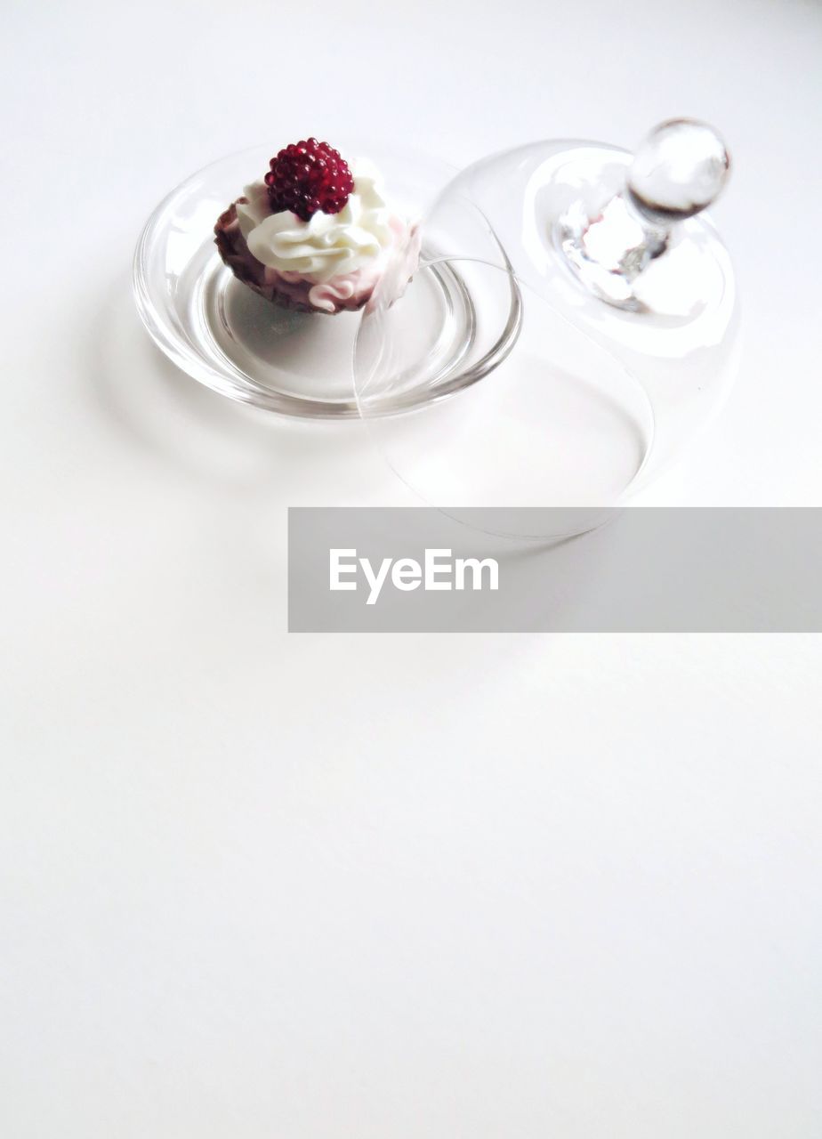 High angle view of cupcake served in glass bowl on table